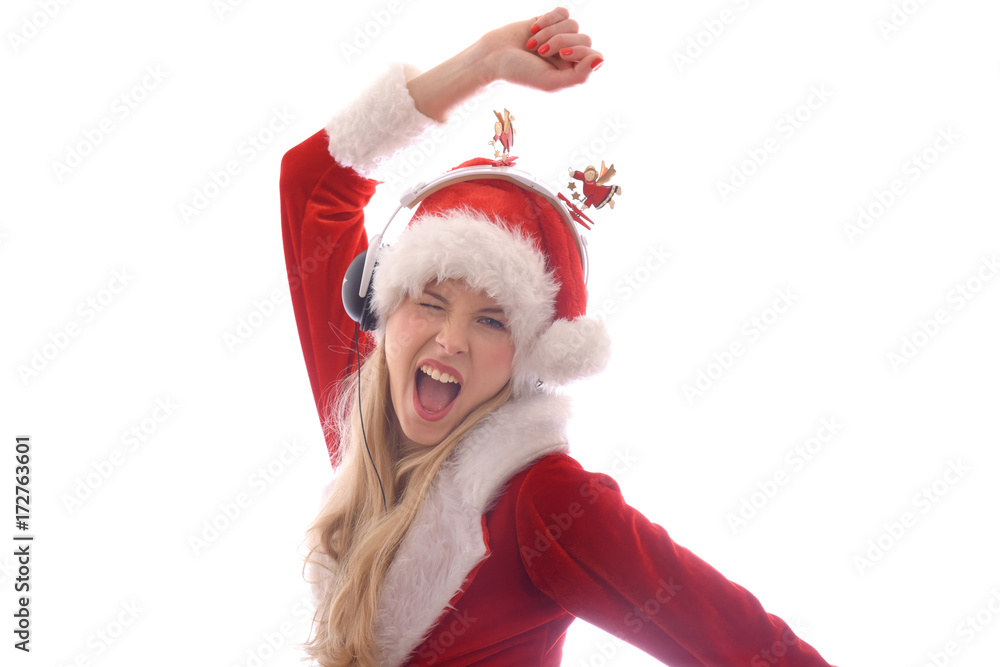 A young girl dresses up as Santa Claus and wants to hear Christmas music. She wears headphones on her head and shouts and yells out the songs she hears.
