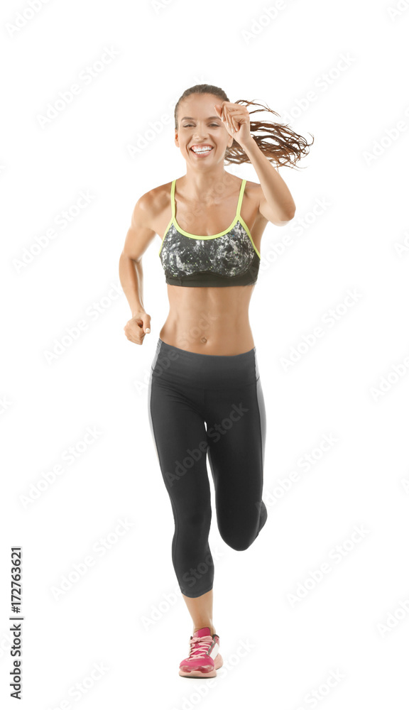 Beautiful young woman in sportswear running on white background Beautiful young woman in sportswear running on white background