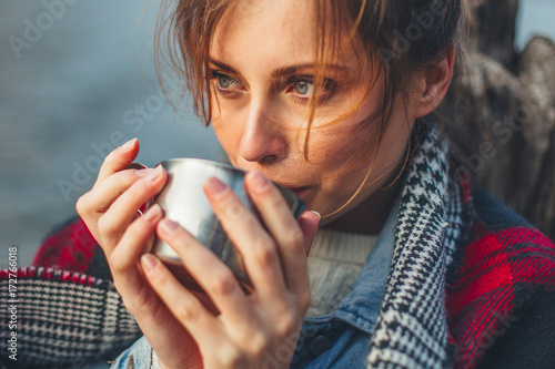 Woman holding hot drink photo