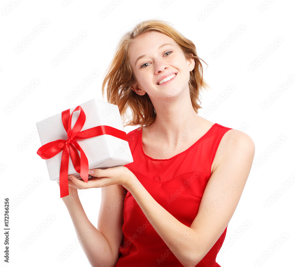 Happy young woman holding a Christmas present Happy young woman holding a Christmas present