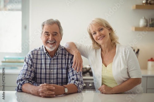 Senior couple sitting in the kitchen