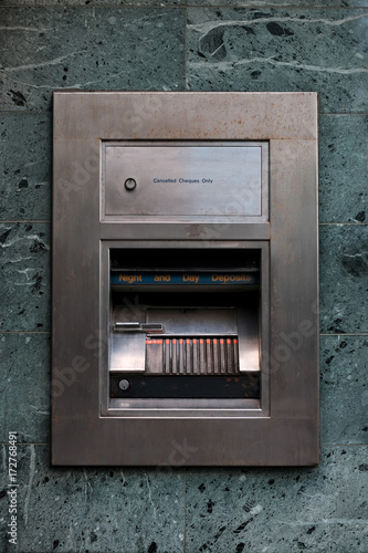 A deposit drawer on the exterior of a bank