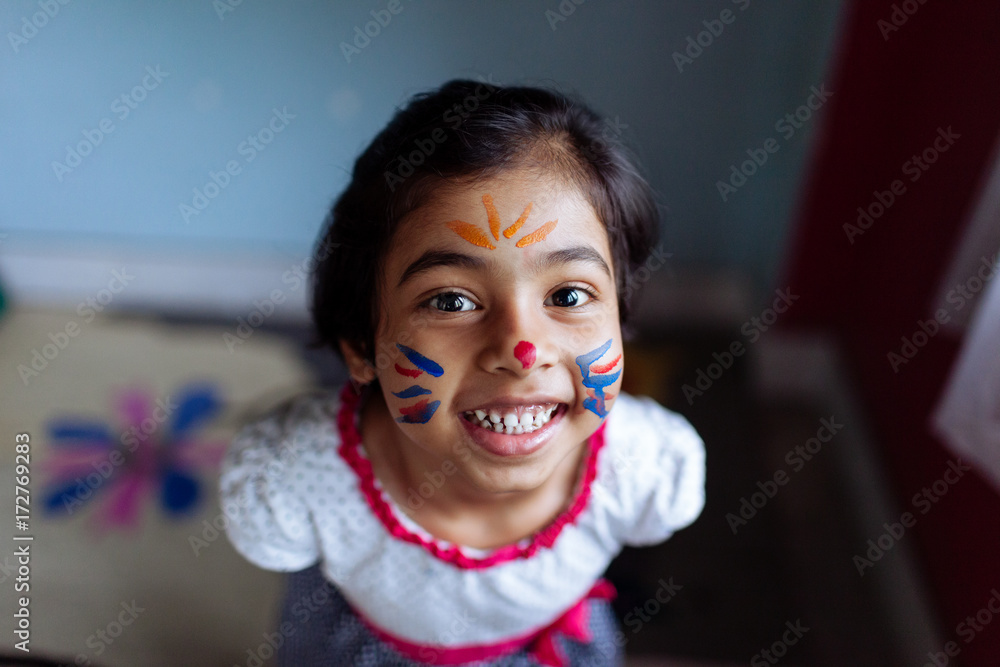 Little girl with a face paint having fun Stock Photo Adobe Stock