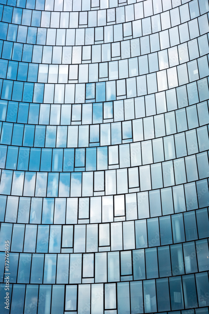Blue sky and clouds reflected in offices windows Blue sky and clouds reflected in offices windows