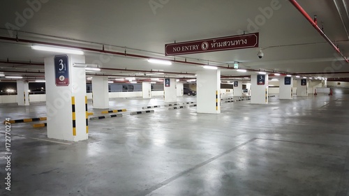 Indoor parking  in shopping center with copy space. The parking lot has enough light so it is safe.car park.