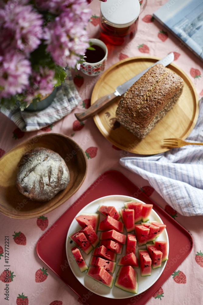 Good afternoon tea time, bread, food and fruit on the table Stock Photo