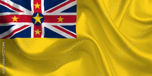 Waving flag of the Niue. Flag in the Wind. National mark. Waving Niue Flag. Niue Flag Flowing.