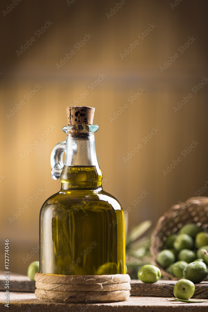 Olive oil and olives on wooden rustic table Olive oil and olives on wooden rustic table