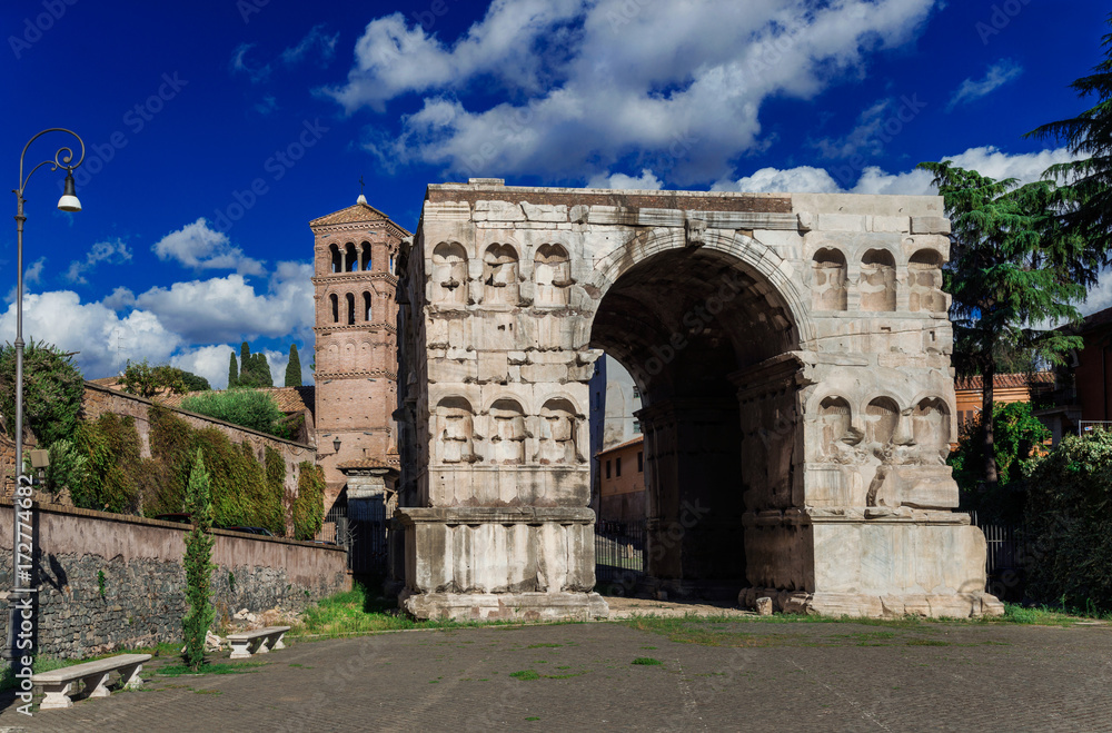 Arch of Janus in Rome with old medieval bell tower
