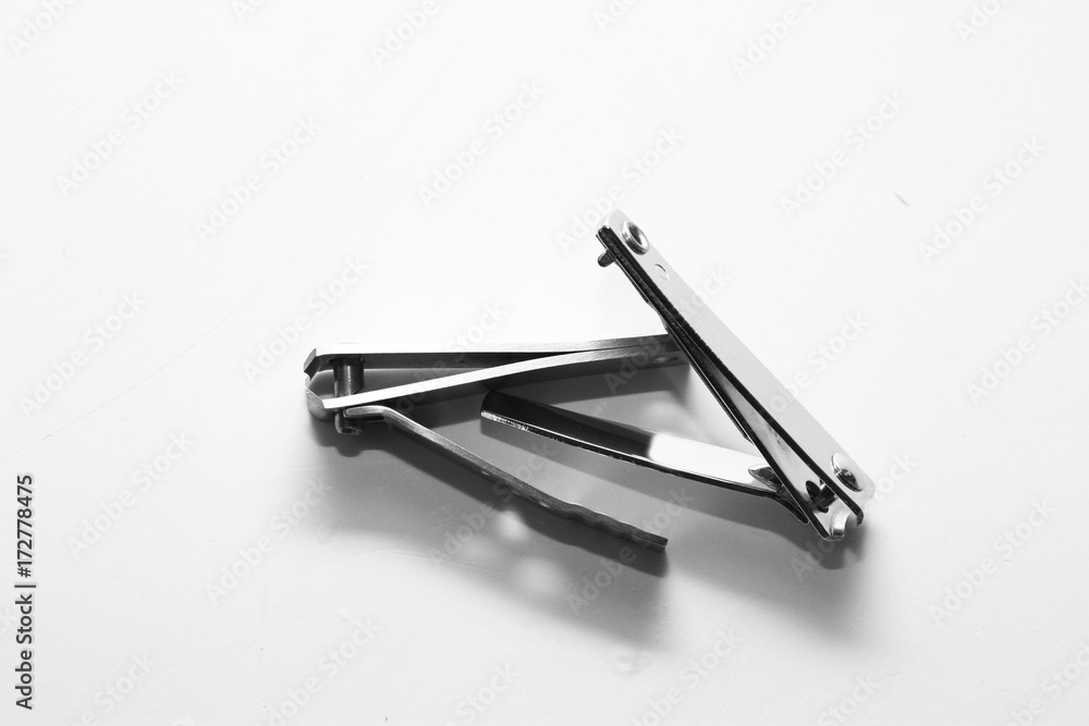 Foto de cutting nails / A nail clipper is a hand tool used to trim