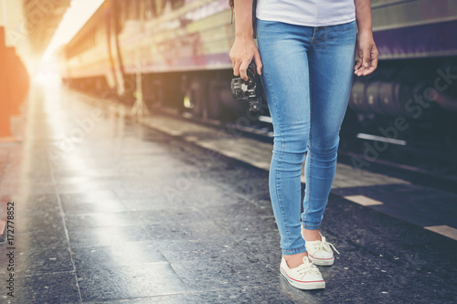 Girl traveling the tourist train station, Active and travel lifestyle concept