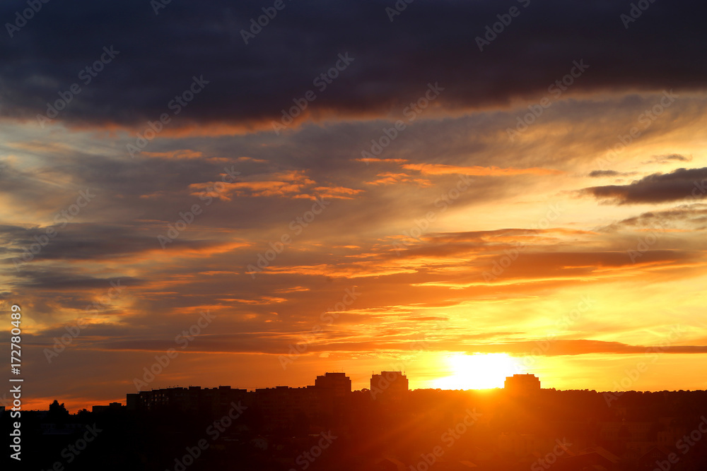 Photo of a brightly beautiful sunset with clouds Photo of a brightly beautiful sunset with clouds