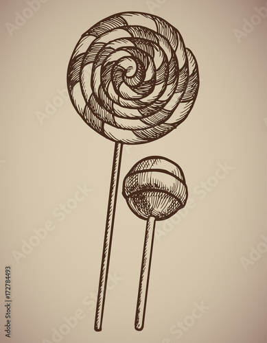 Engraving Lollipops. Engraving two candies. A huge spiral lollipop and a round candy on a stick. Engraving menu for the restaurant. Vector illustration.