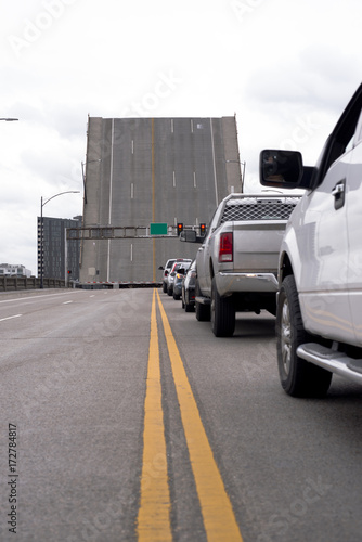 Burnside bridge across the river with an automobile road lifted for passage of a ship photo