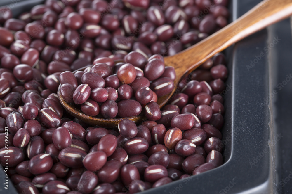 Red beans closeup and a wooden spoon. Red beans closeup and a wooden spoon.