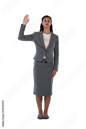 Businesswoman raising her hand