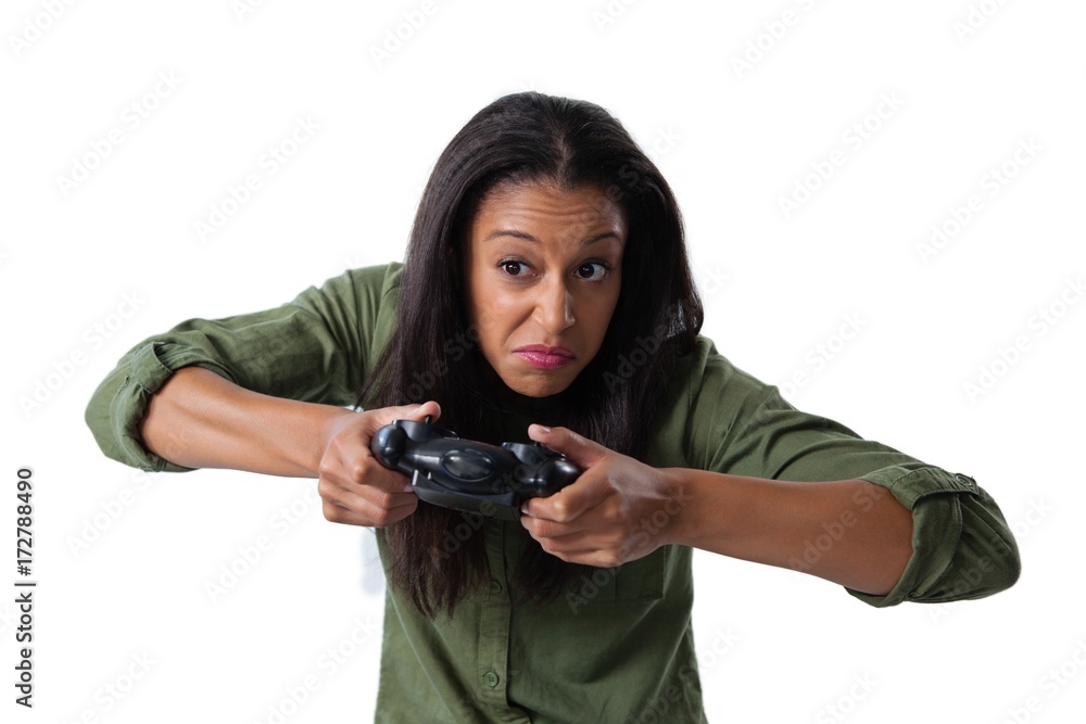 Woman making funny faces while playing video games Woman making funny faces while playing video games