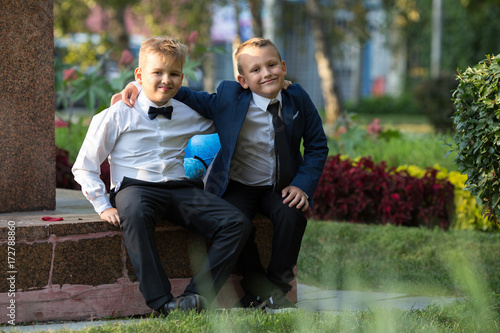 Portrait of two boys friends, school children with globes in the garden. Portrait, childhood, game. © vasilievae
