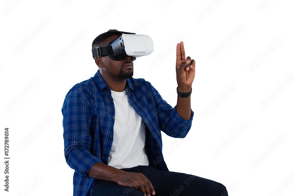 Man gesturing while using virtual reality headset Man gesturing while using virtual reality headset