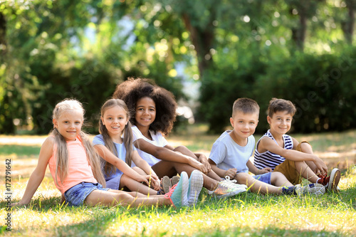 Group of children sitting o...