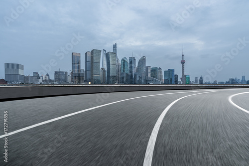 urban traffic road with cityscape in background in Shanghai China..