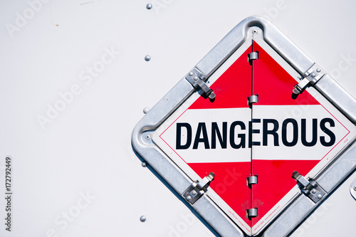 The sign dangerous in the safety box on the semi trailer wall
