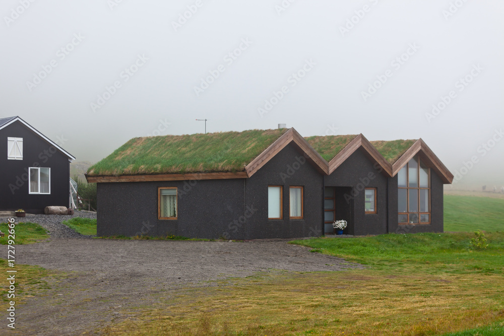 Rural Icelandic cottage at foggy day
