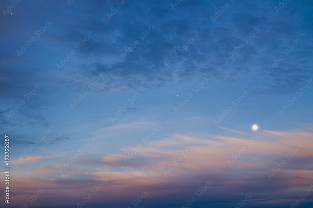 Beautiful night sky with moon and stars, majestic sunset. Sky and clouds at beautiful evening.