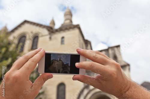 Tourist taking photo of Perigueux, France