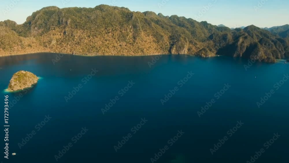 Aerial view: beach, tropical island, sea bay and lagoon, mountains with rainforest, Palawan. Lagoon with blue, azure water in the middle of small islands and rocks. Busuanga. Seascape, tropical Aerial view: beach, tropical island, sea bay and lagoon, mountains with rainforest, Palawan. Lagoon with blue, azure water in the middle of small islands and rocks. Busuanga. Seascape, tropical