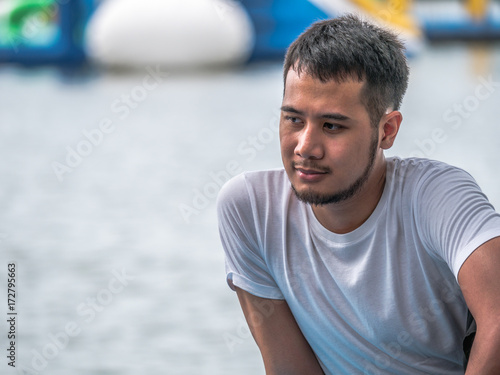 A young man take a relax at the lake