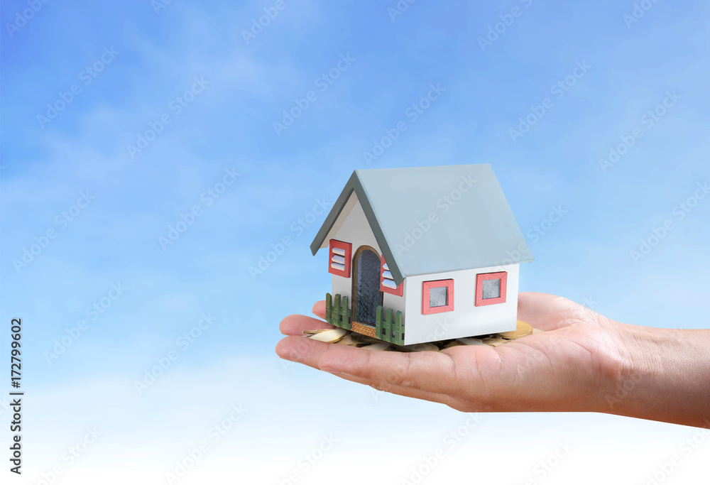 salesman person giving to buyer customer,house in hand salesman person giving to buyer customer,house in hand