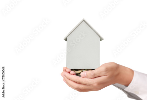 salesman person giving to buyer customer,house in hand