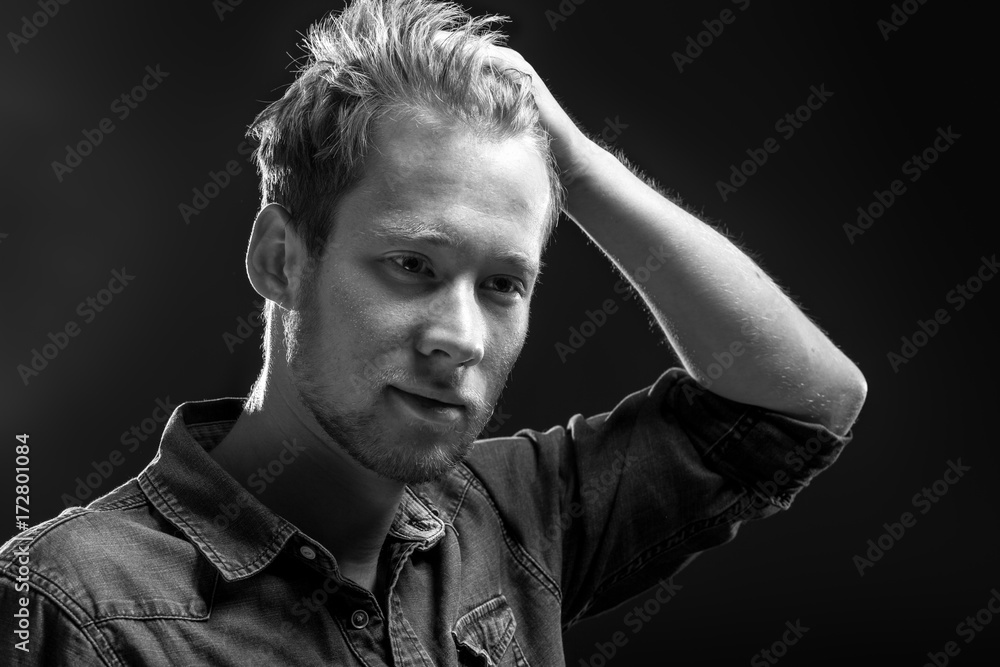 Fototapeta premium Young man on grey background.