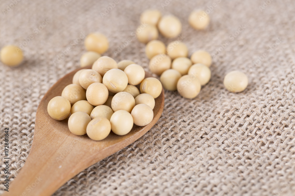 Soy beans and wooden spoon. Soy beans and wooden spoon.