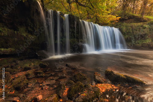 Fototapeta Naklejka Na Ścianę i Meble -  Sgwd Ddwli Uchaf waterfall, part of the waterfall country trail of falls, on the river Neath, near Pontneddfechan in South Wales, UK
