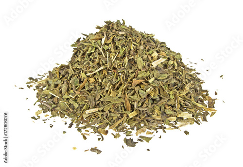 Heap of chopped tarragon leaves on a white background