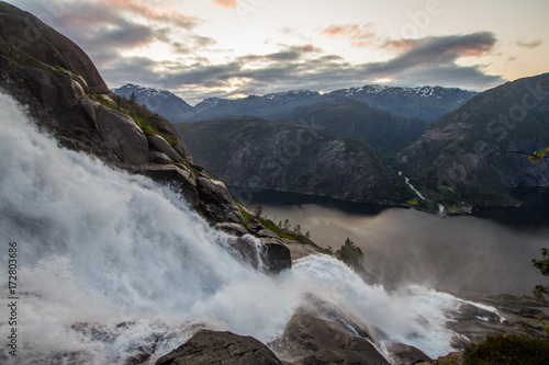 Summer mountain Langfossen waterfall on slope  Etne  Norway .