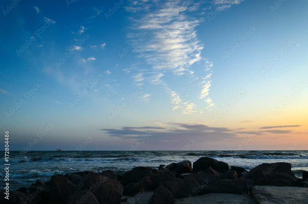 Obraz premium Clouds over the sea at sunset