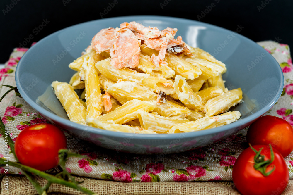 tasty pasta with salmon on a the table tasty pasta with salmon on a the table