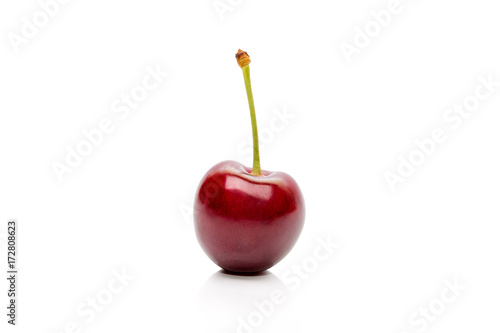 Cherry on a peduncle isolated on a white background © Lyudmila Tetera