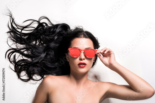 young woman in red eyeglasses