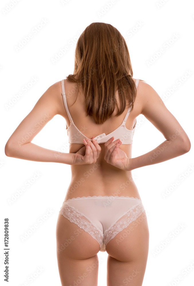 Woman in panties dress or undress white bra back side isolated white  background Stock Photo