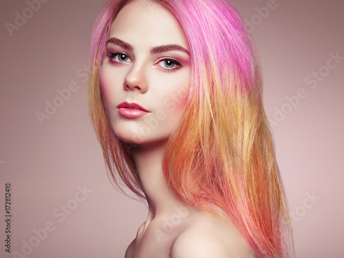 Beauty fashion model girl with colorful dyed hair. Girl with perfect makeup and hairstyle. Model with perfect healthy dyed hair © Oleg Gekman