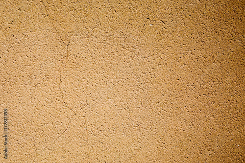 Yellow grunge cement wall Natural art wallpaper or artistic texture background