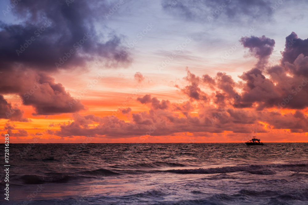 Red sky over Atlantic Ocean coast at sunset Red sky over Atlantic Ocean coast at sunset