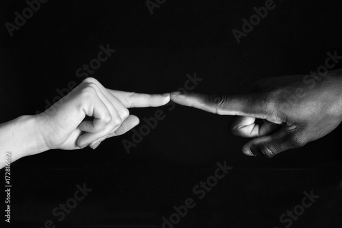 Detail of finger african and caucasian, man and woman