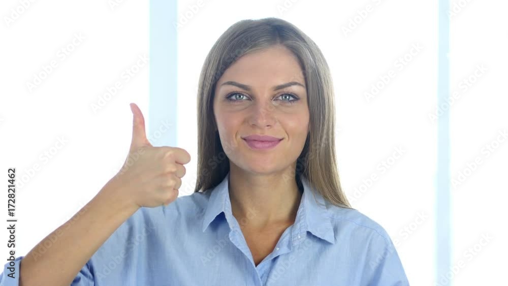 Portrait of Positive Young Woman Gesturing Thumbs Up Portrait of Positive Young Woman Gesturing Thumbs Up