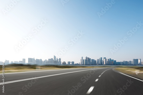 empty asphalt road with cityscape of modern city