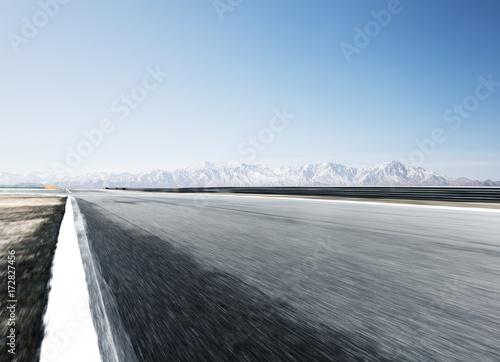 empty asphalt road with beautiful snow mountains
